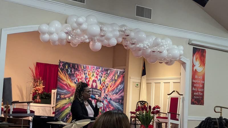A speaker addresses a cancer awareness celebration