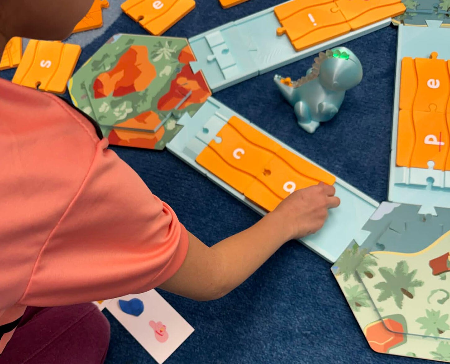 Child using the Dash alphabet path