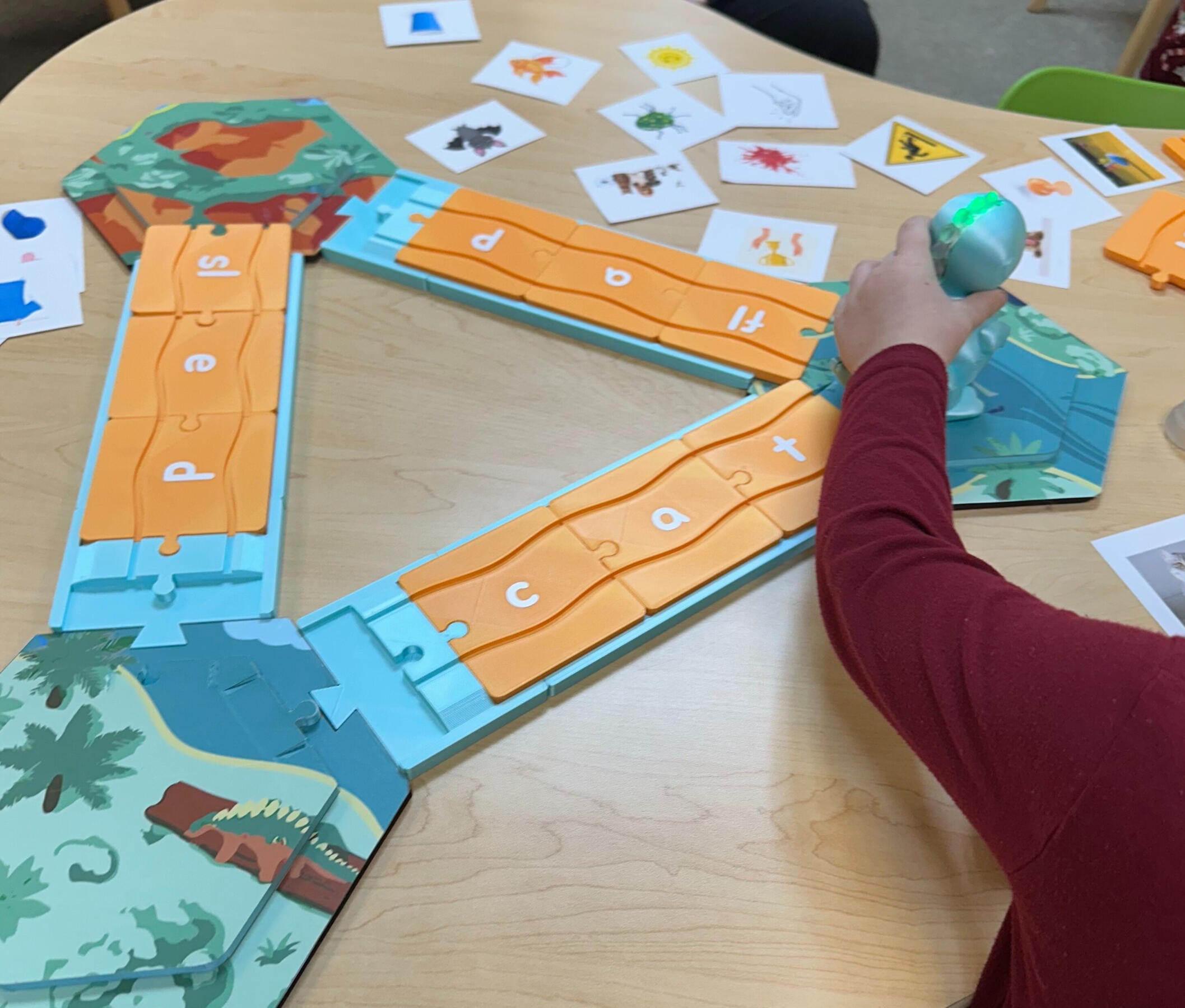 Dash the Dino alphabet adventure playset arranged on a table