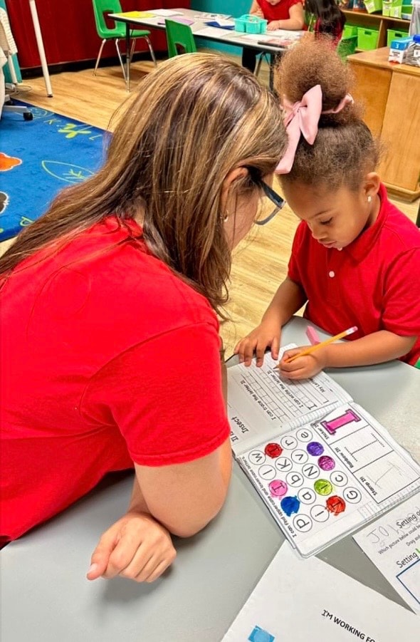 Child participating in a caring classroom activity