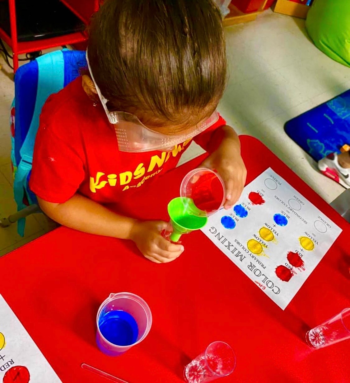 Child practicing creative work at a table