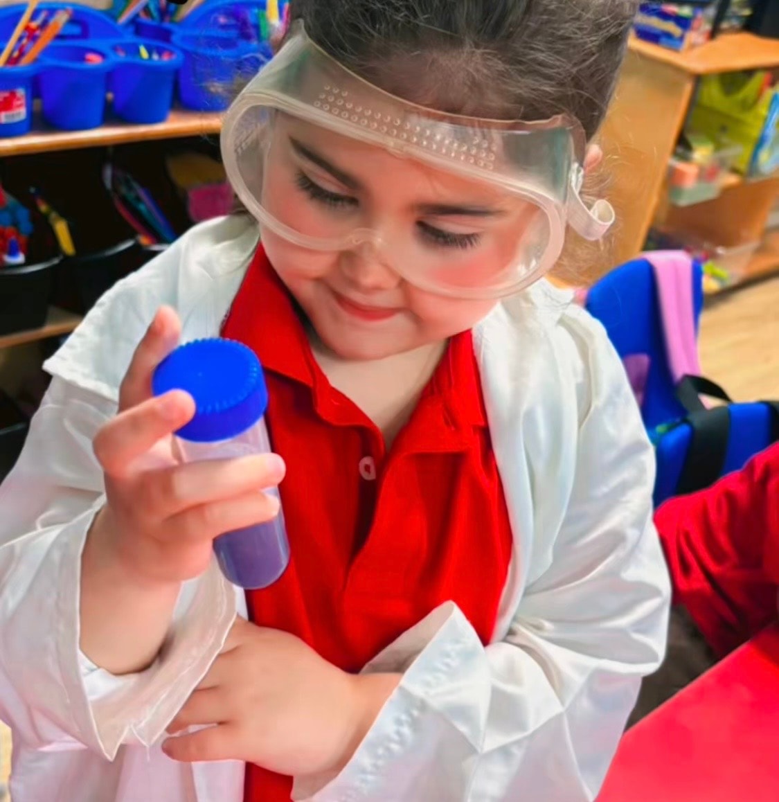 Child exploring a creative classroom activity