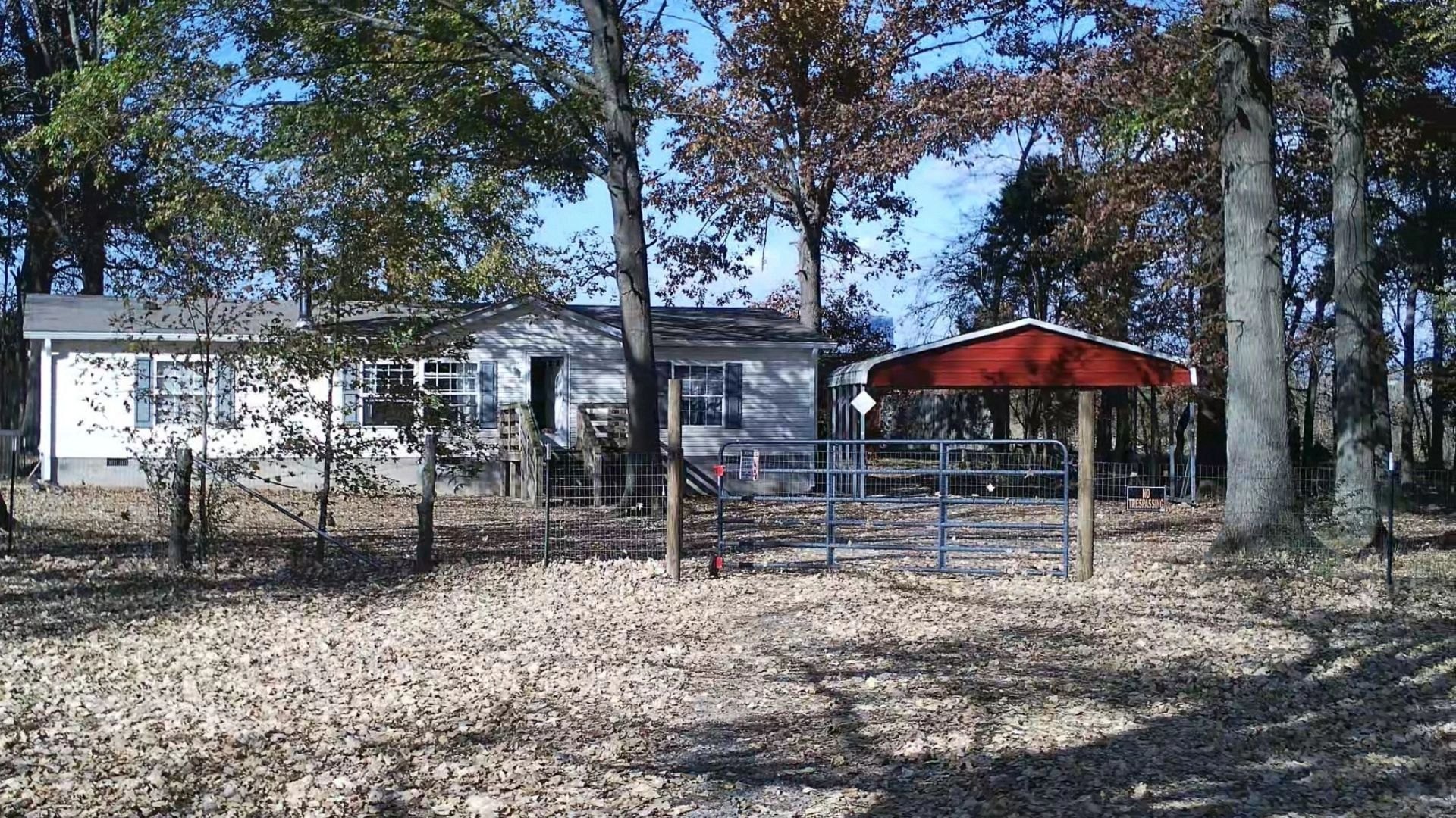 House, barn, and trees at New Sentinel Acres