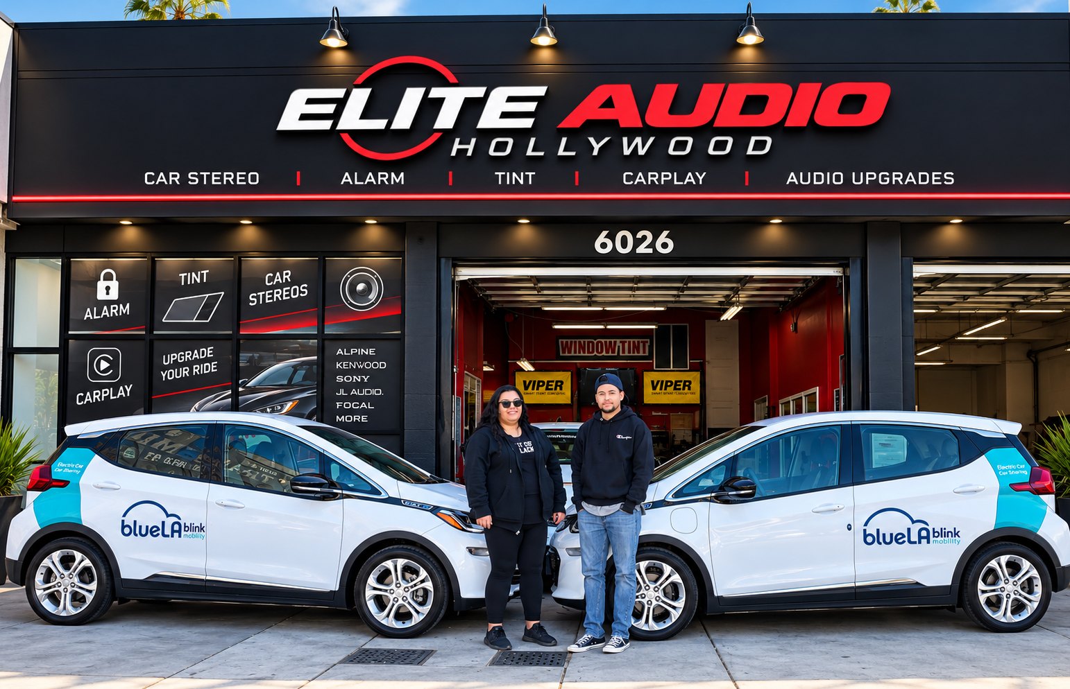 BlueLA powered by Blink Mobility vehicles and Elite Audio Hollywood team members outside the Elite Audio storefront