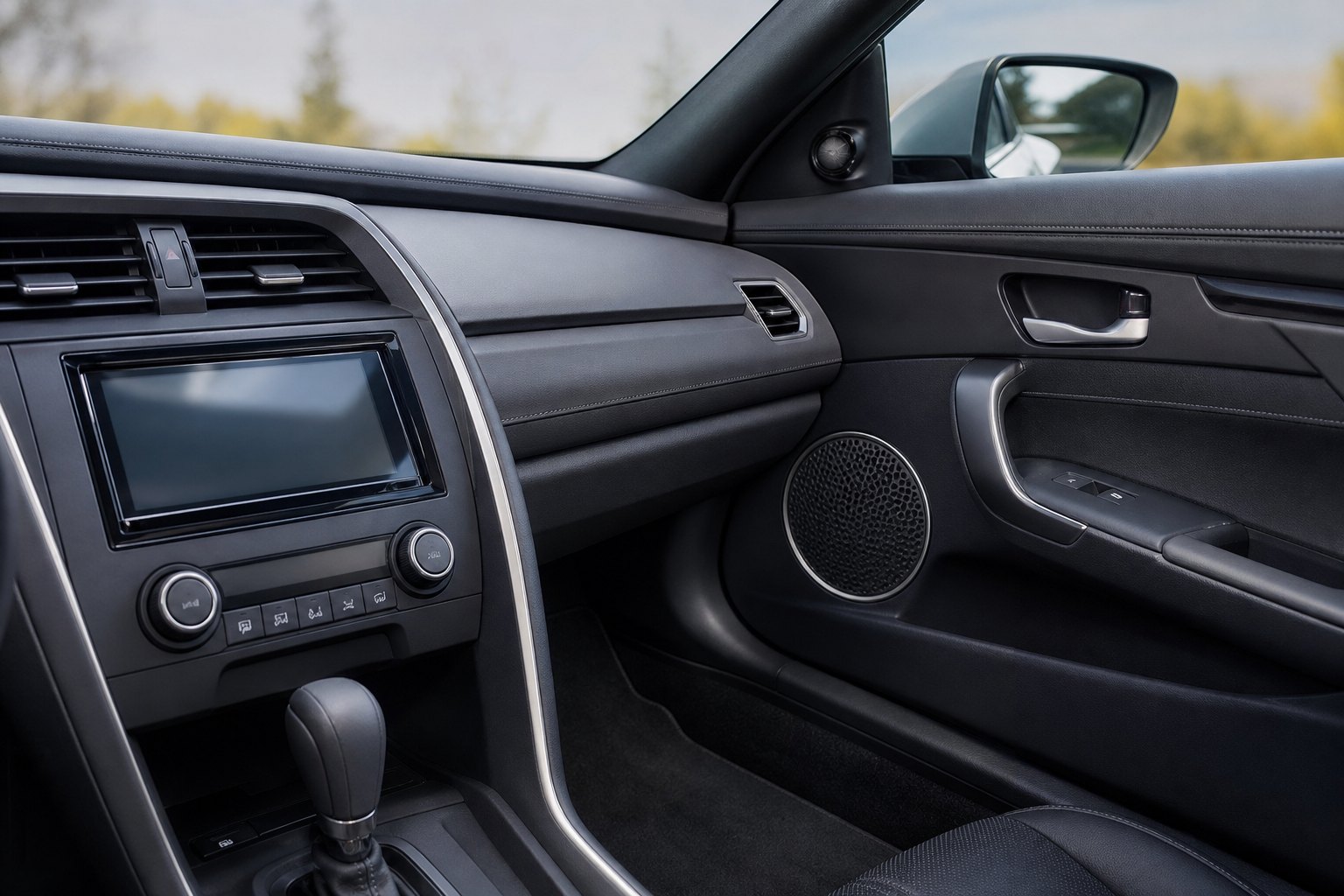 Cleanly integrated aftermarket touchscreen stereo in a vehicle dashboard
