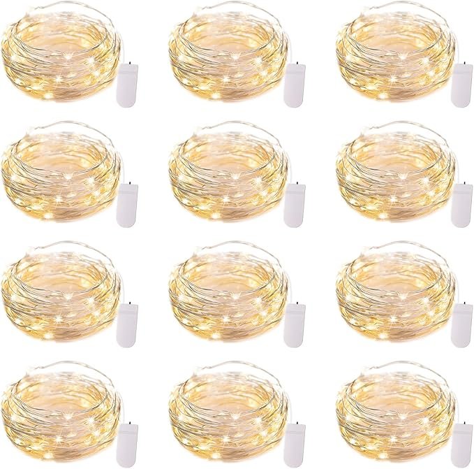 Twelve coiled strands of warm white Brightown fairy lights with silver wire and white battery packs