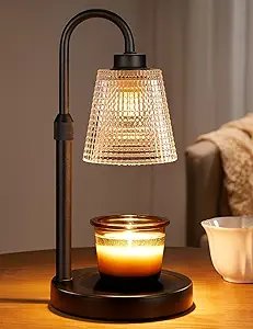 Innqoo candle warmer lamp with a black curved stand and textured glass shade above a jar candle