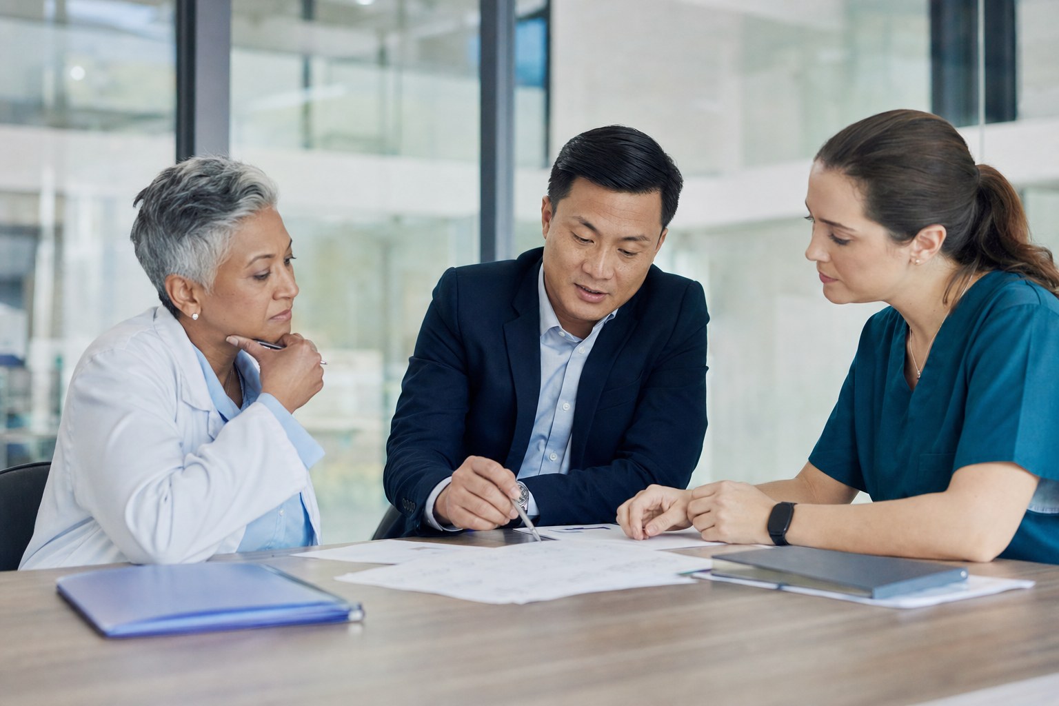Healthcare leaders working through a cross-functional change decision