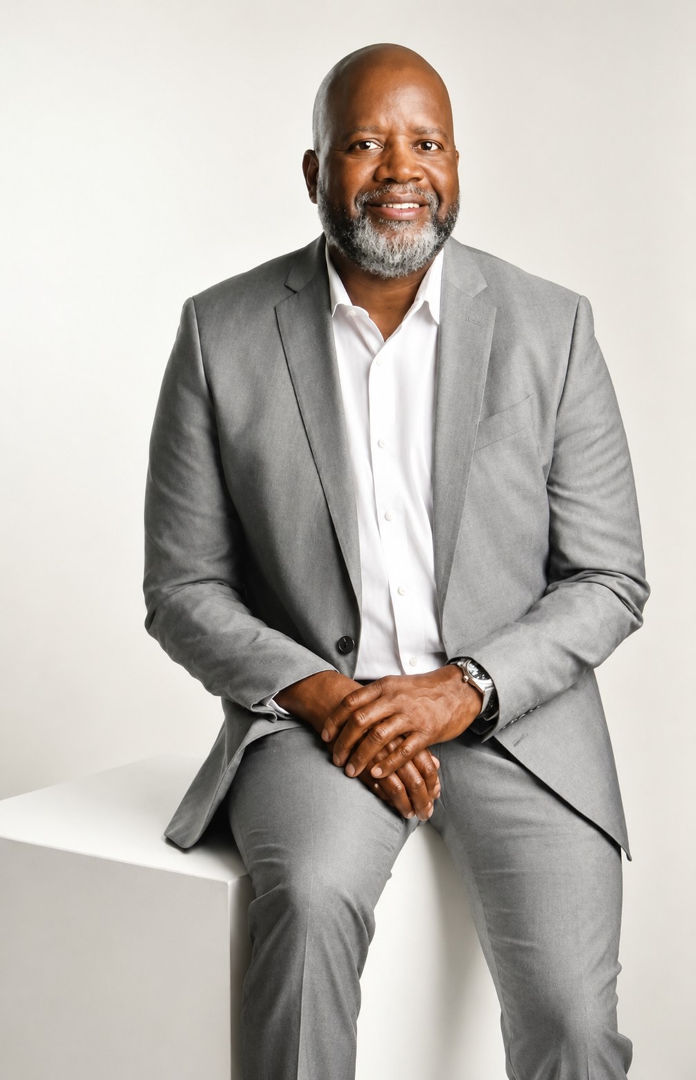 Michael R. Morgan seated in a gray suit