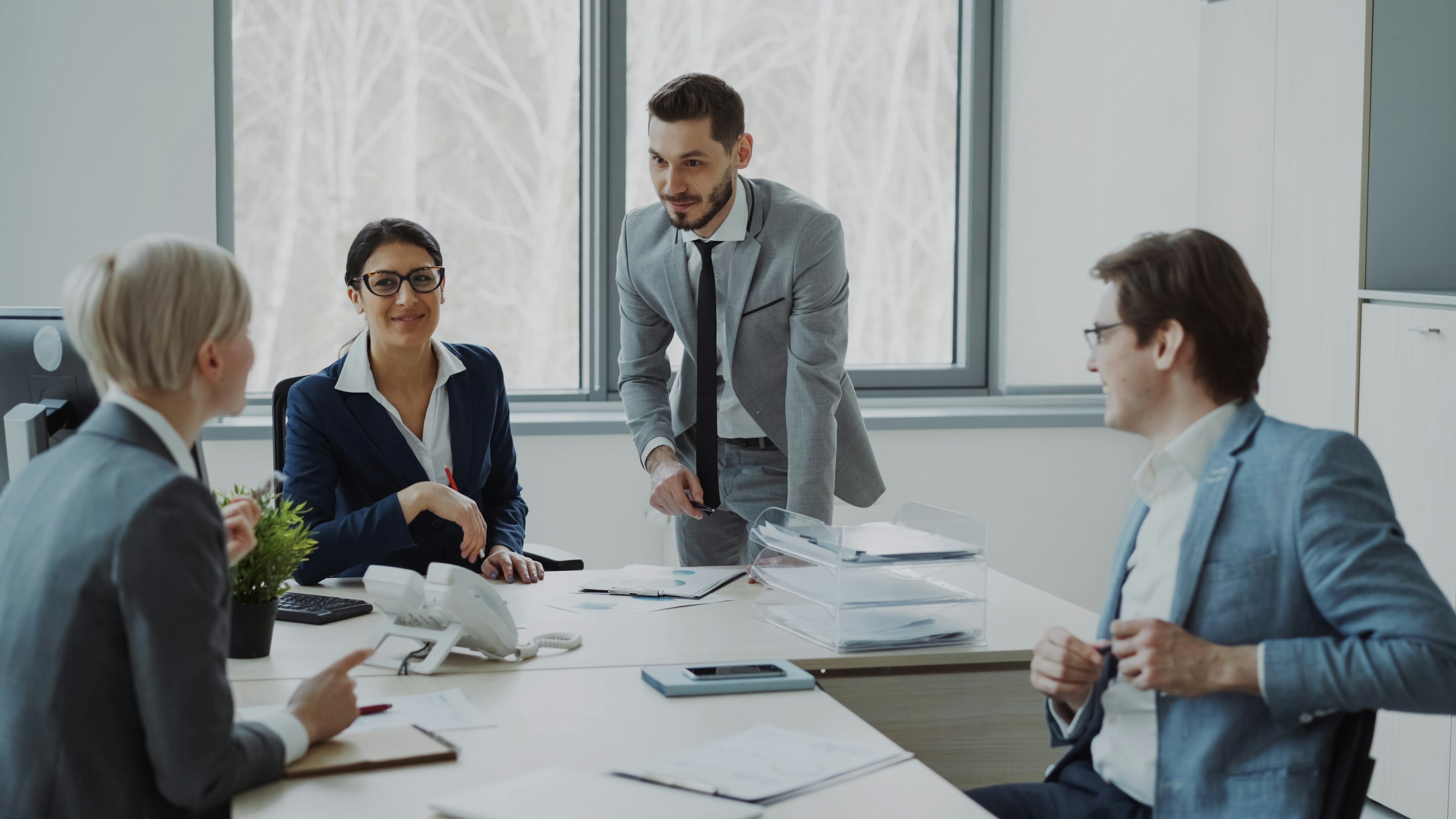 Leadership team collaborating around a conference table