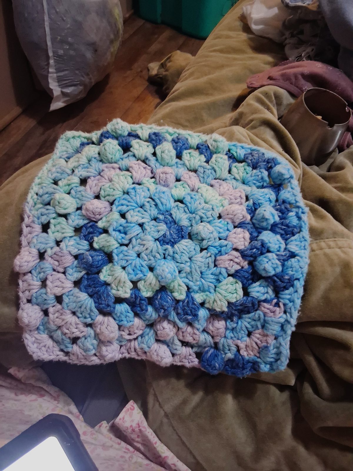 Blue, mint, and lilac crochet dishcloth with puff stitches