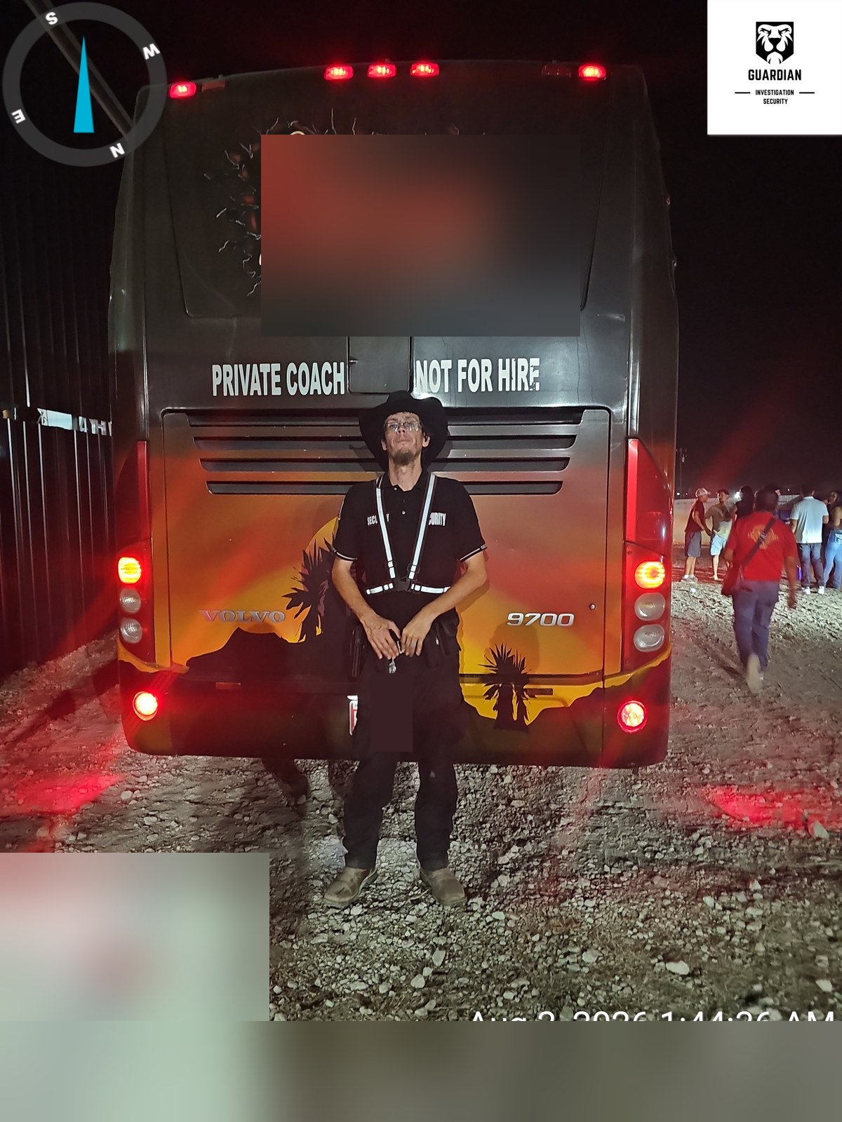 Guardian team member beside a coach during nighttime coverage