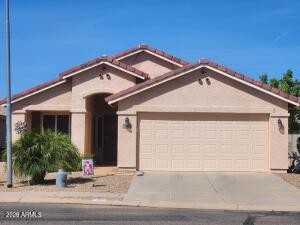 Front exterior of 36 South Valencia Court in Mission Royale, Casa Grande