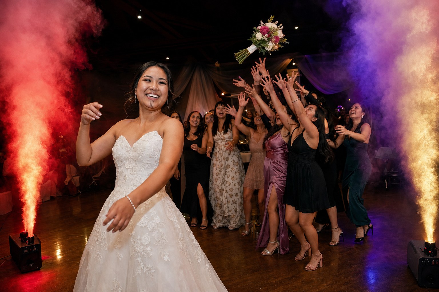 Bride and wedding guests celebrating during a bouquet toss