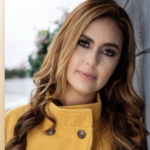 Salon Demetri client portrait in a yellow coat