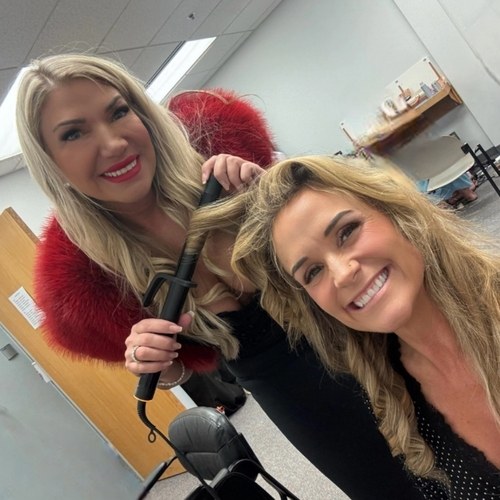 Stylist creating a curled look for a Salon Demetri client