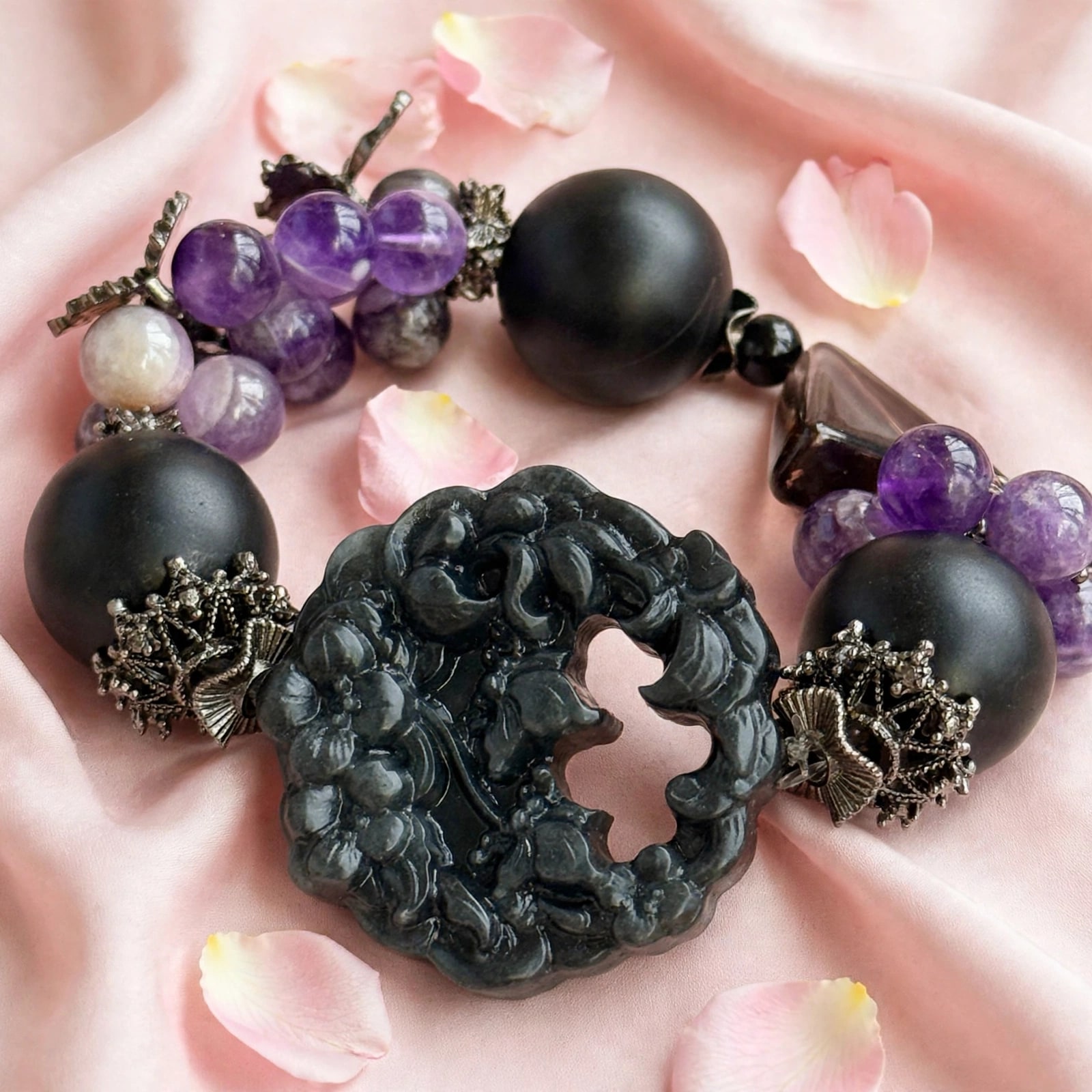 Amethyst, smoky quartz, black onyx, and carved obsidian butterfly bracelet