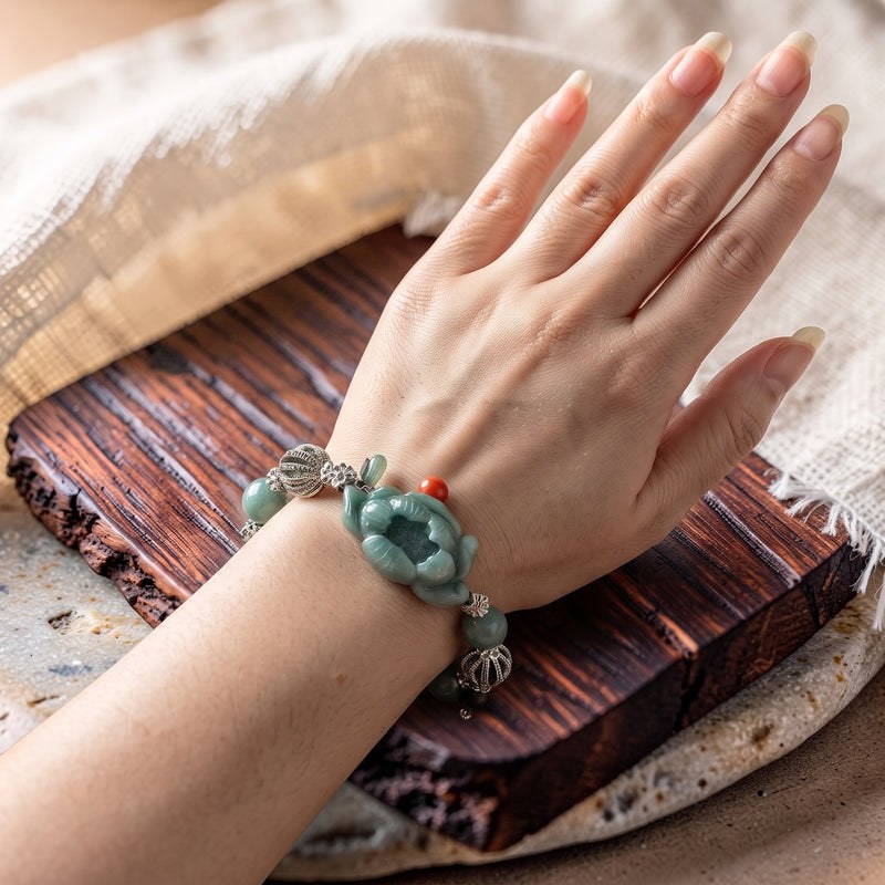 Hand-carved jade lotus bracelet with silver crown spacers