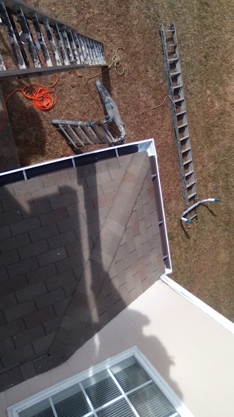 Gutters installed on a two-story home