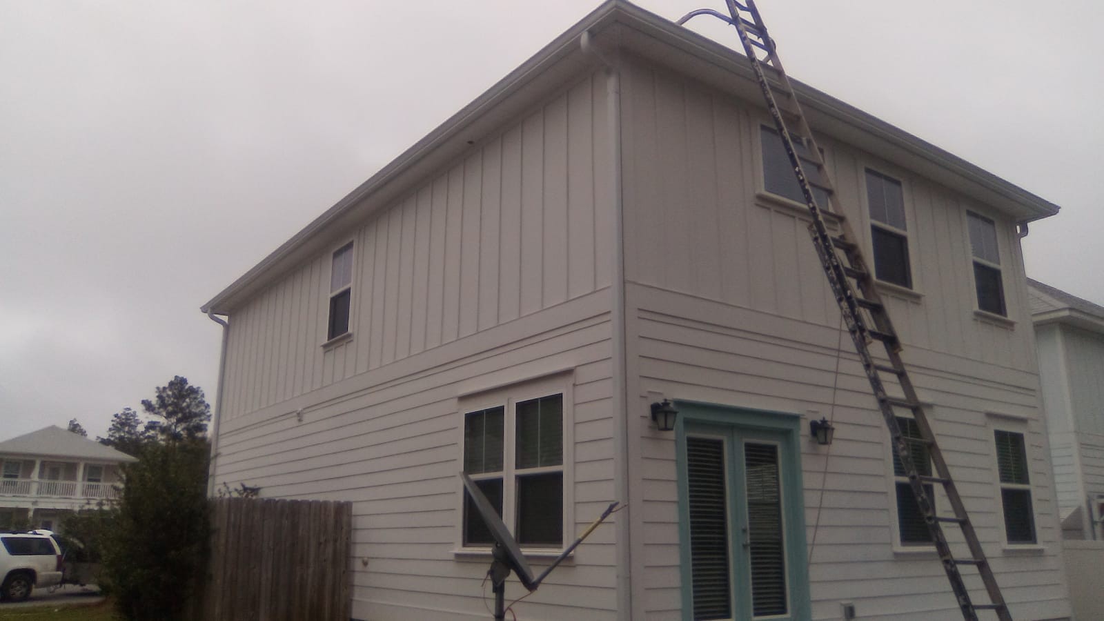 Gutter installation on a white home