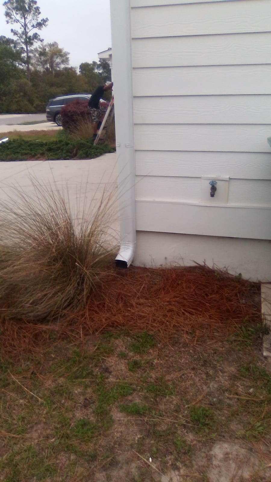 Gutter installation at a two-story home
