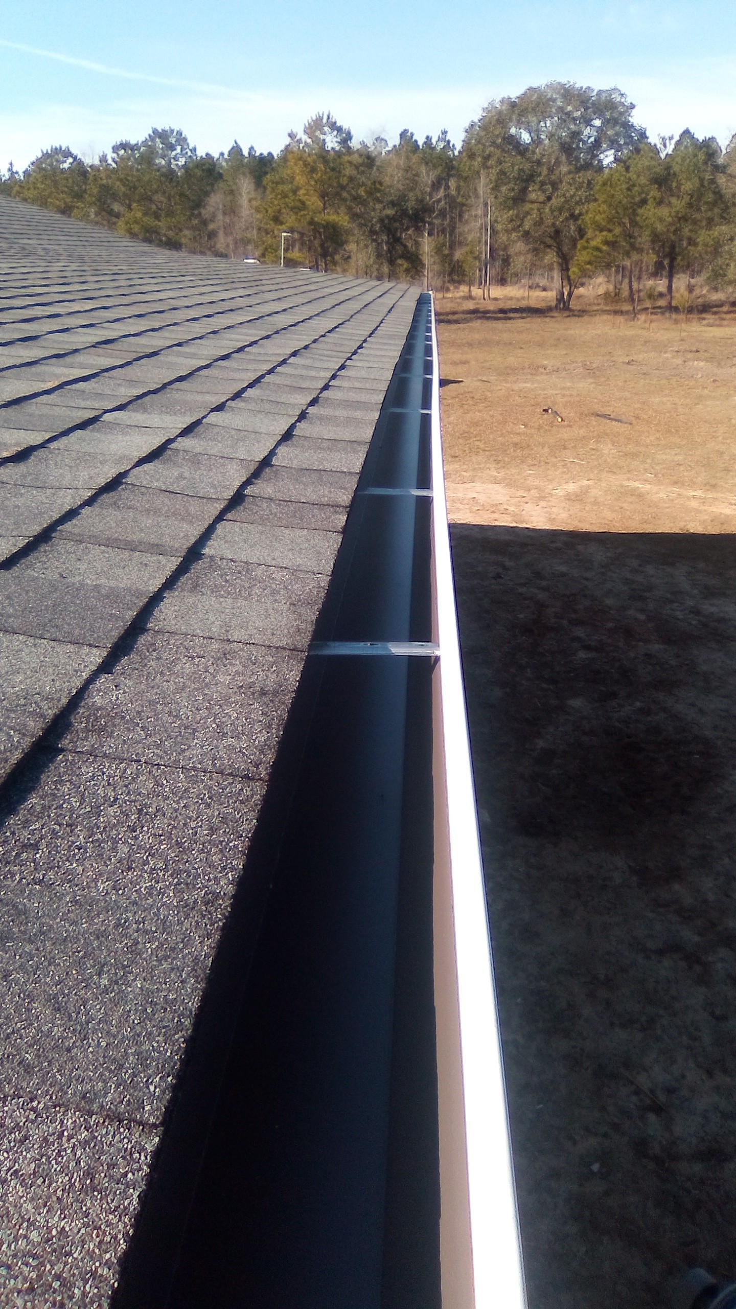 Gutter installation overlooking a rural property