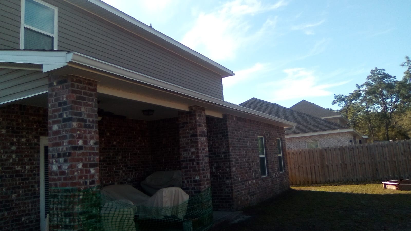 Gutter work at a covered patio