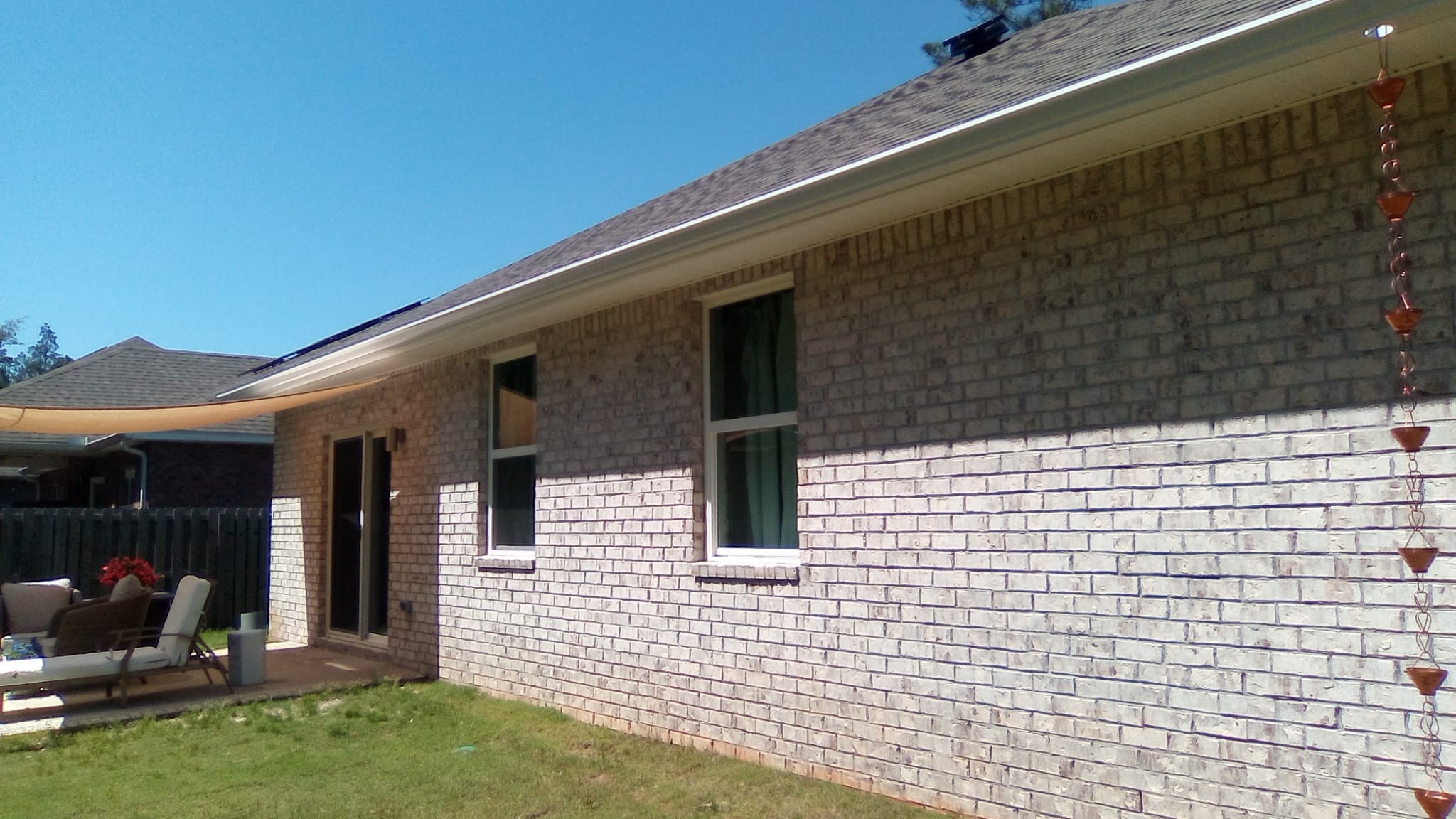 Seamless gutter installation on a residential home
