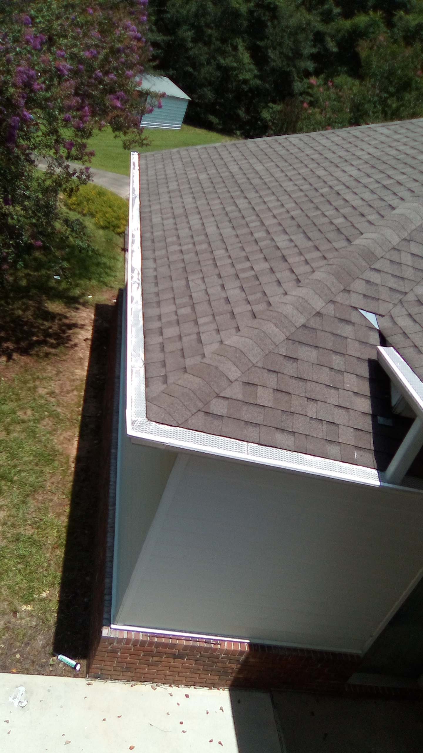 White seamless gutter installed along a residential roofline in Enterprise