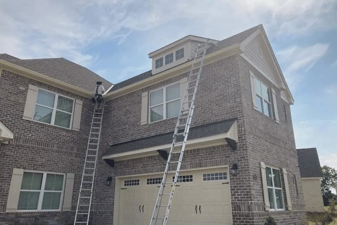 White seamless gutters installed along a residential roofline
