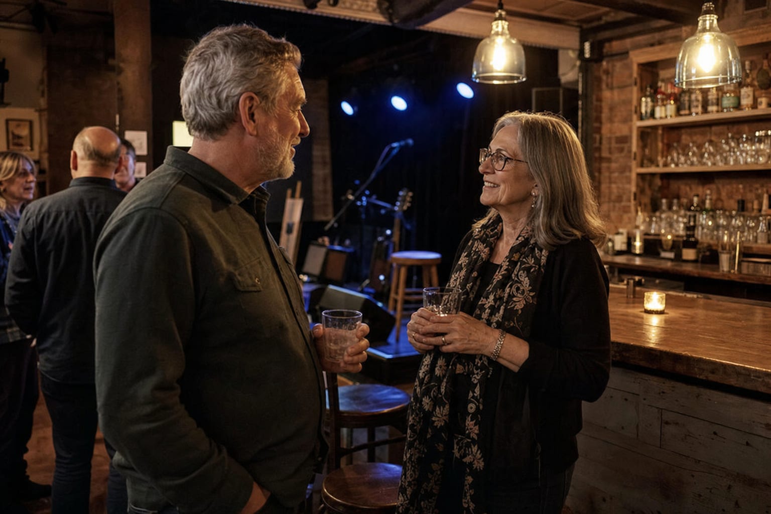 Two concertgoers having a friendly conversation between sets