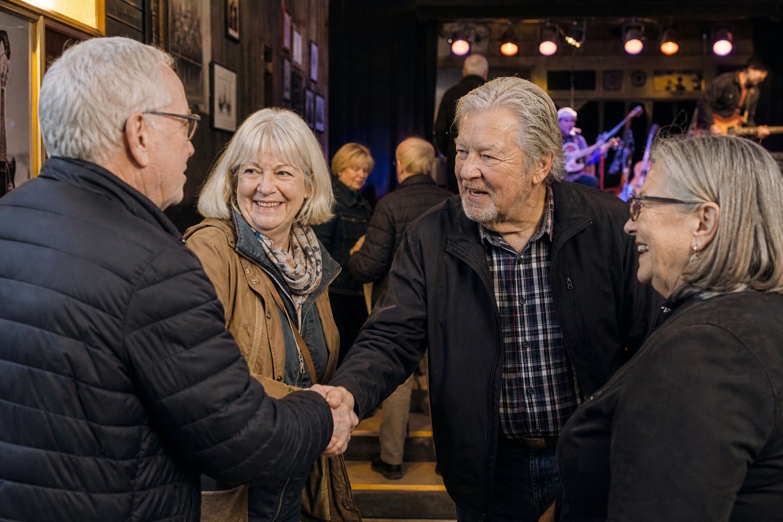 Older friends greeting one another before a local live music show