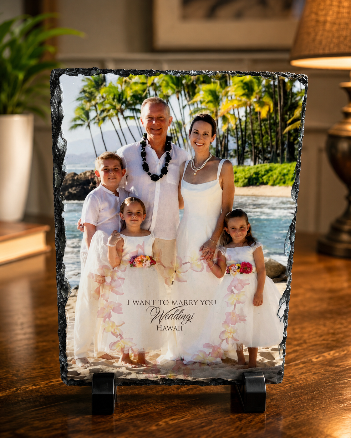 Family portrait etched on a handcrafted slate keepsake displayed on a table