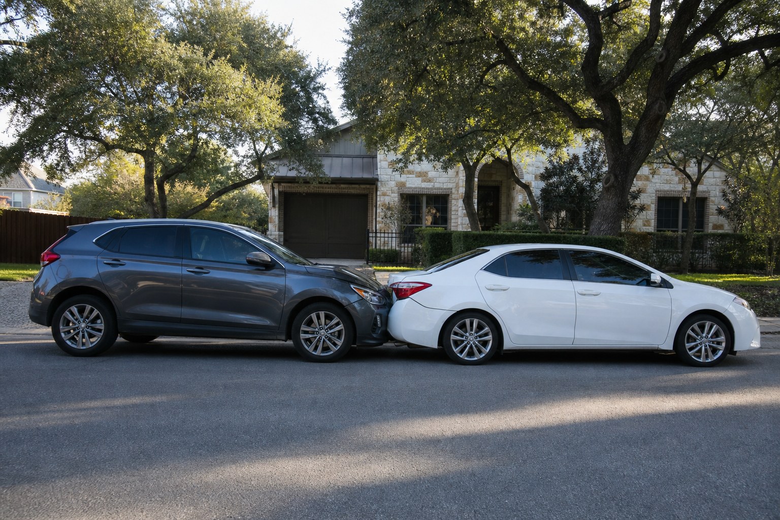 Two vehicles after a minor rear-end collision on a residential street