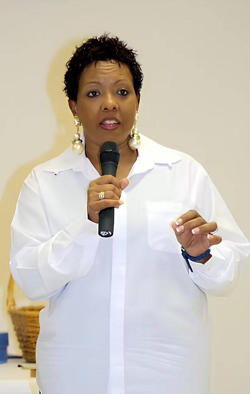 Million Heir-Williams speaking with a microphone