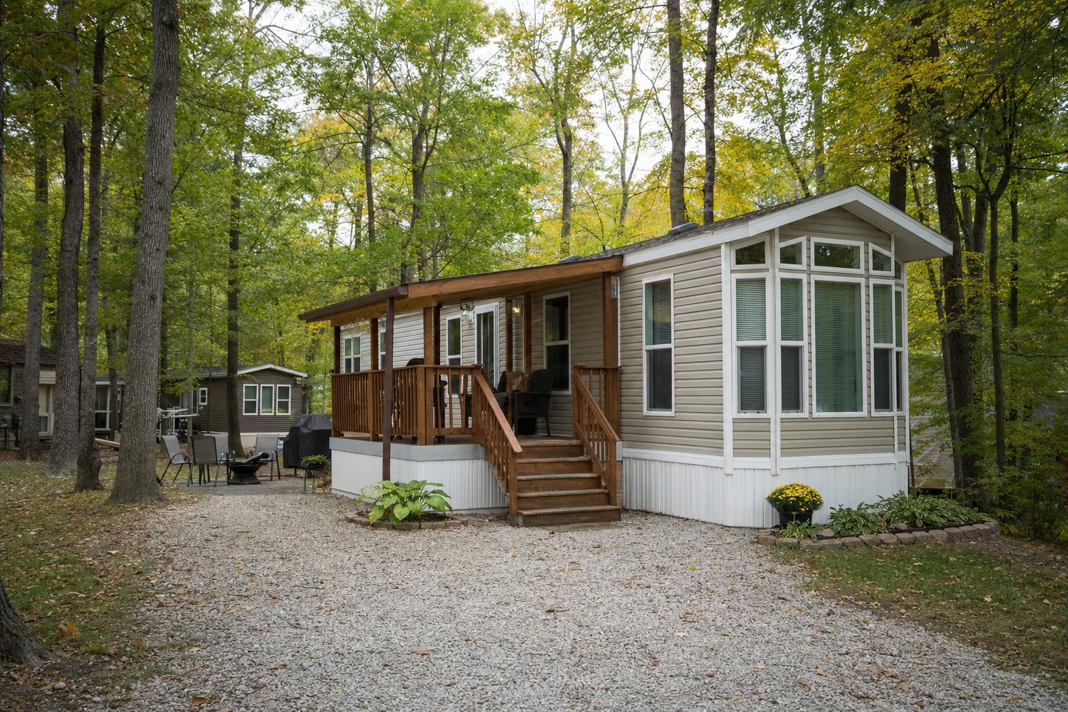 Park model home at a wooded seasonal campground