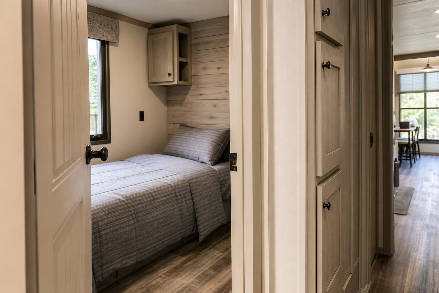 Compact secondary bedroom and storage in a park model