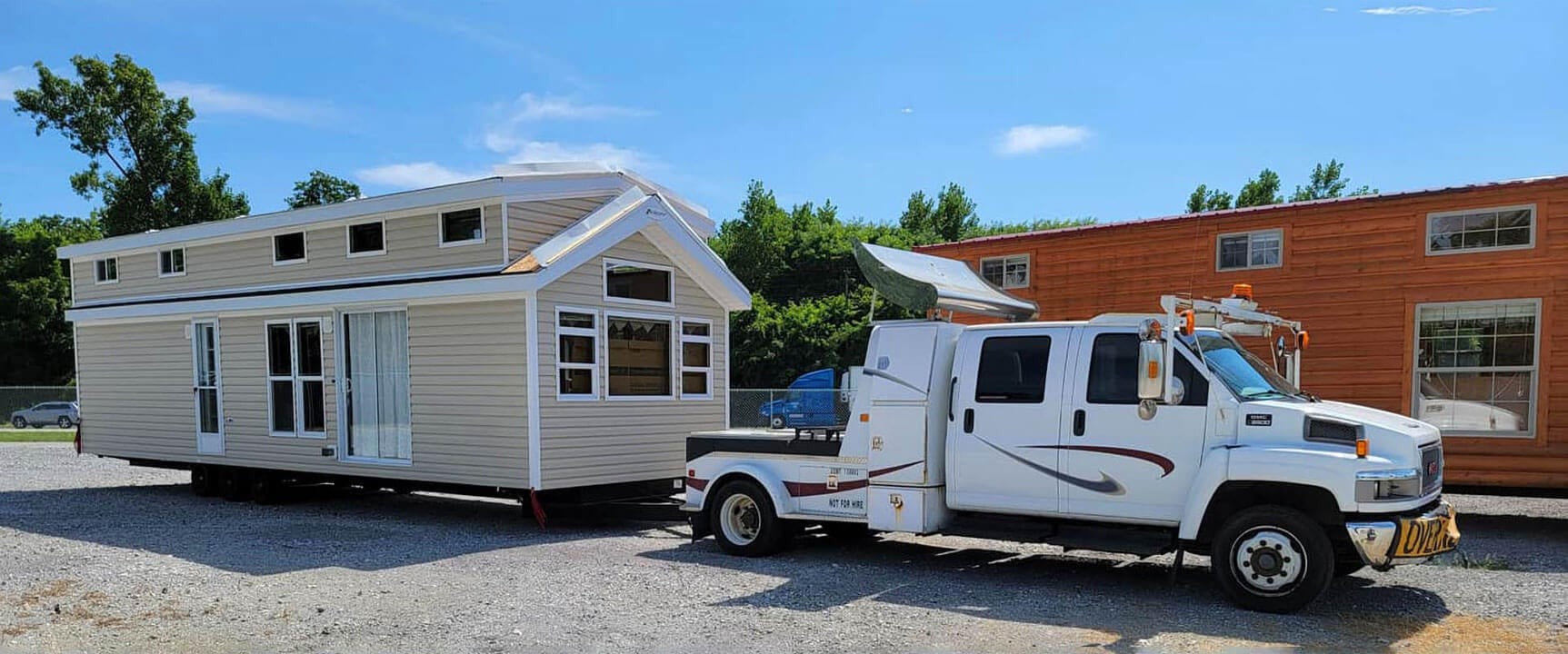 Suncoast transport truck delivering an RV