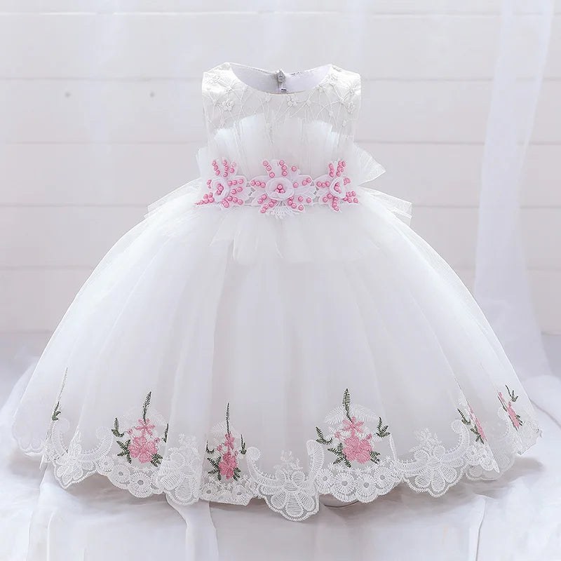 White and pink flower dress for a baby girl's celebration