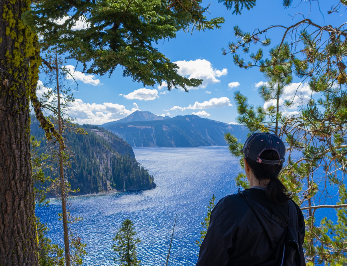 View across Crater Lake, framed by pines, photographed by Susanne Harm