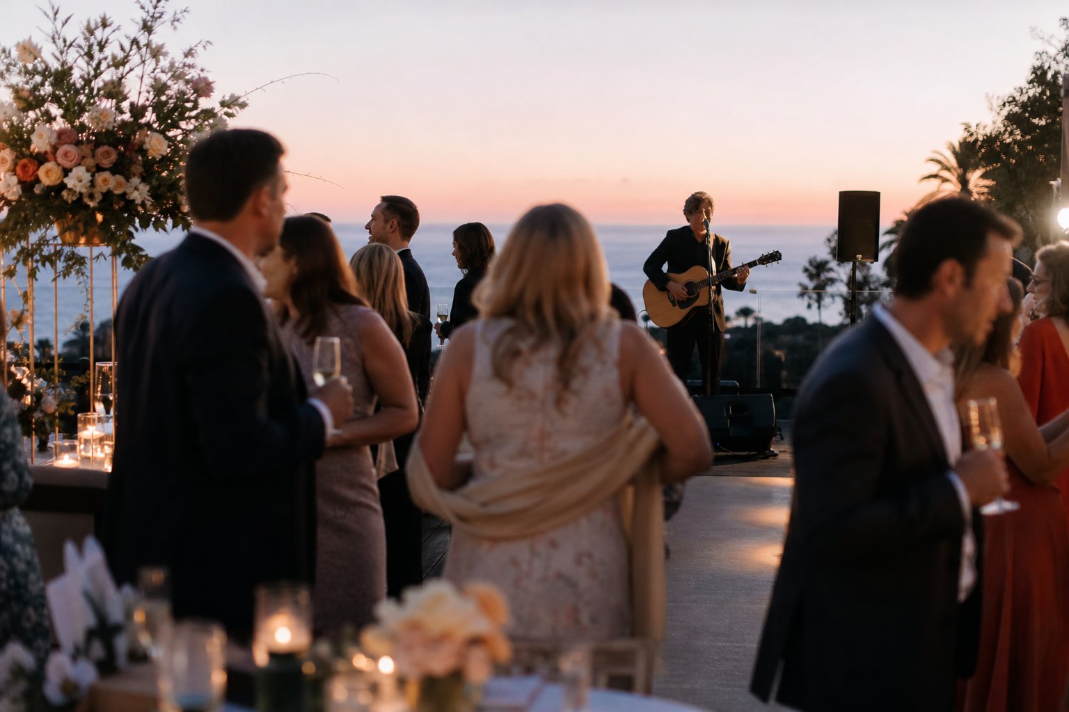 Live guitarist performing during a coastal wedding cocktail hour