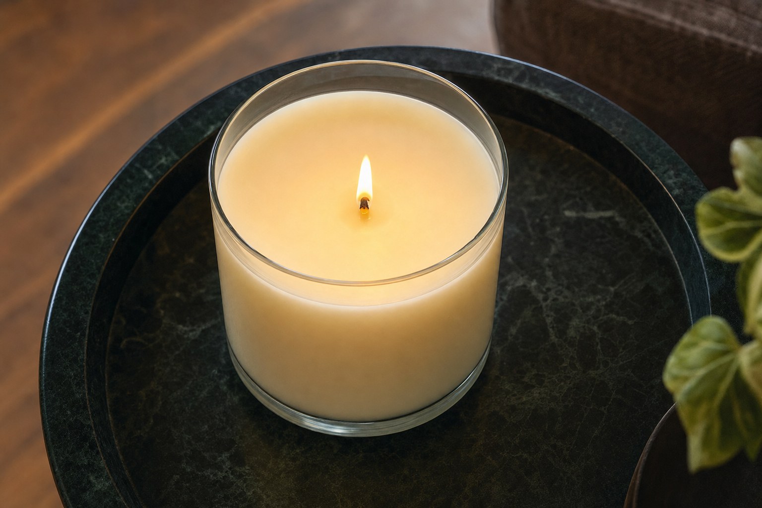 A container candle with a broad, even melt pool and a tidy wick.