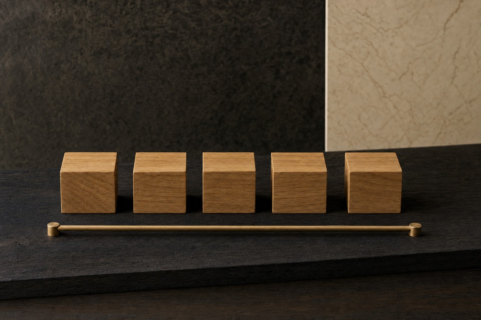 Five wooden blocks arranged in a straight line above a brass guide rail