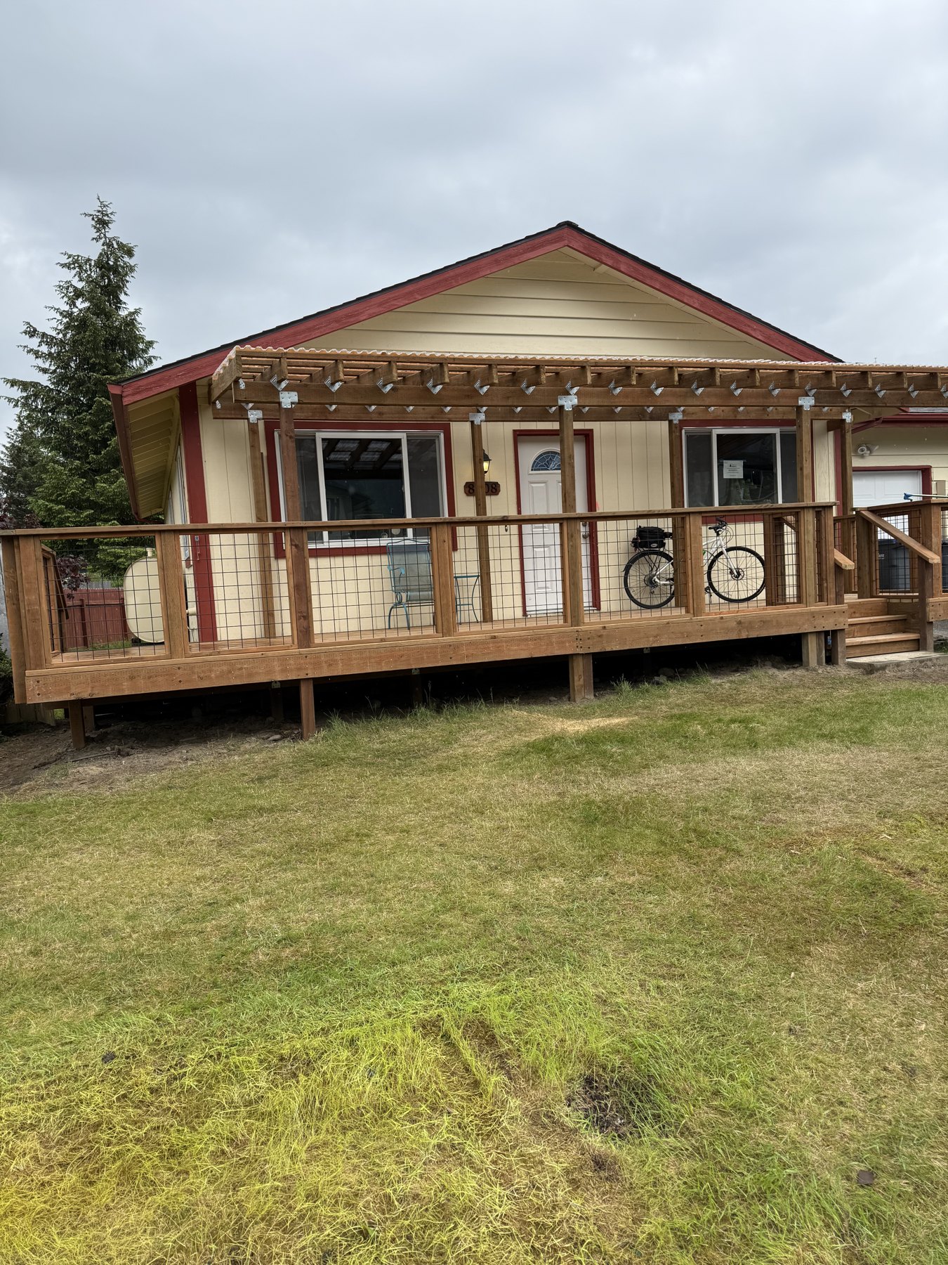 Wood deck wrapping around a home