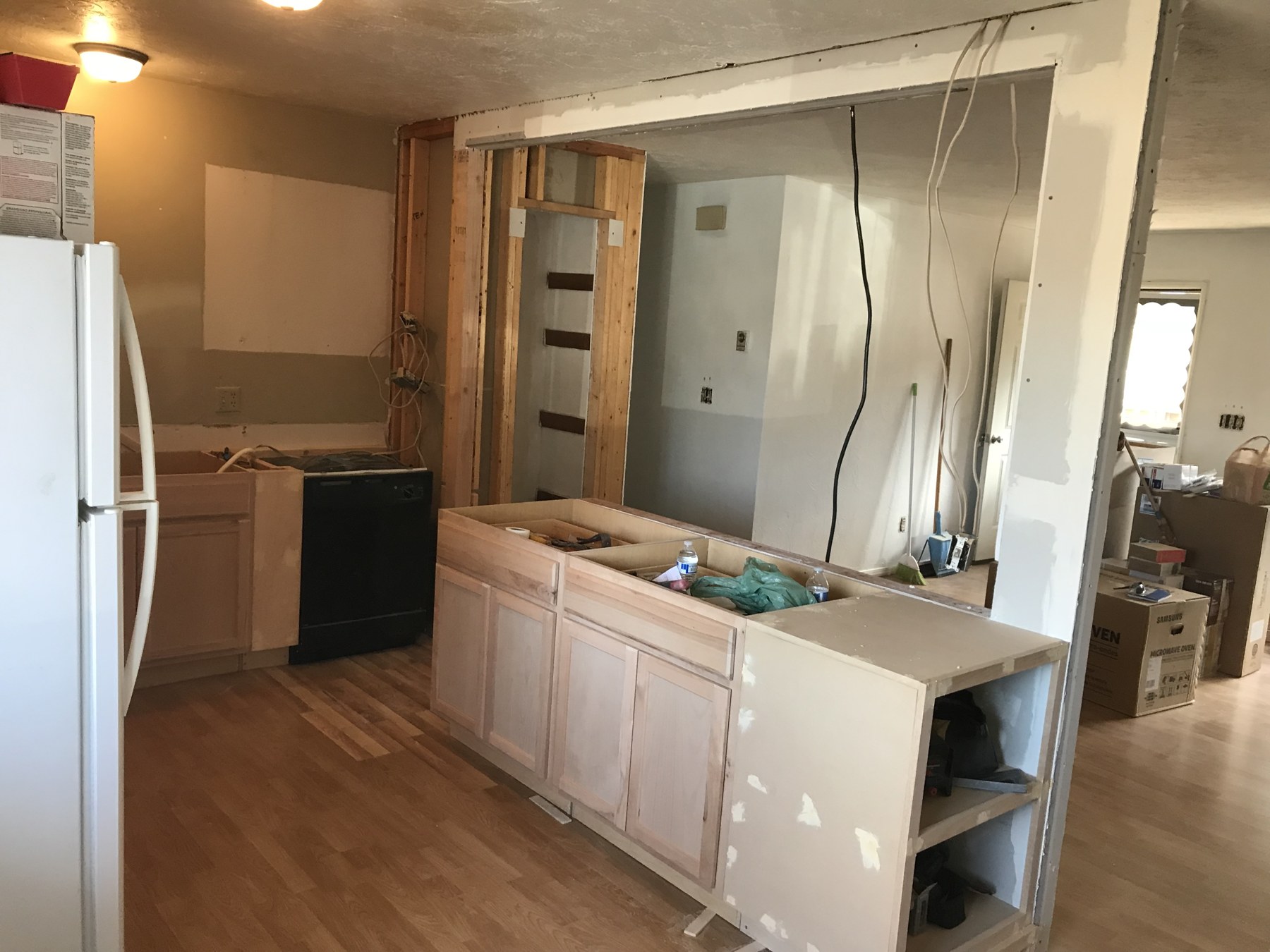 Kitchen renovation with cabinetry and an open wall