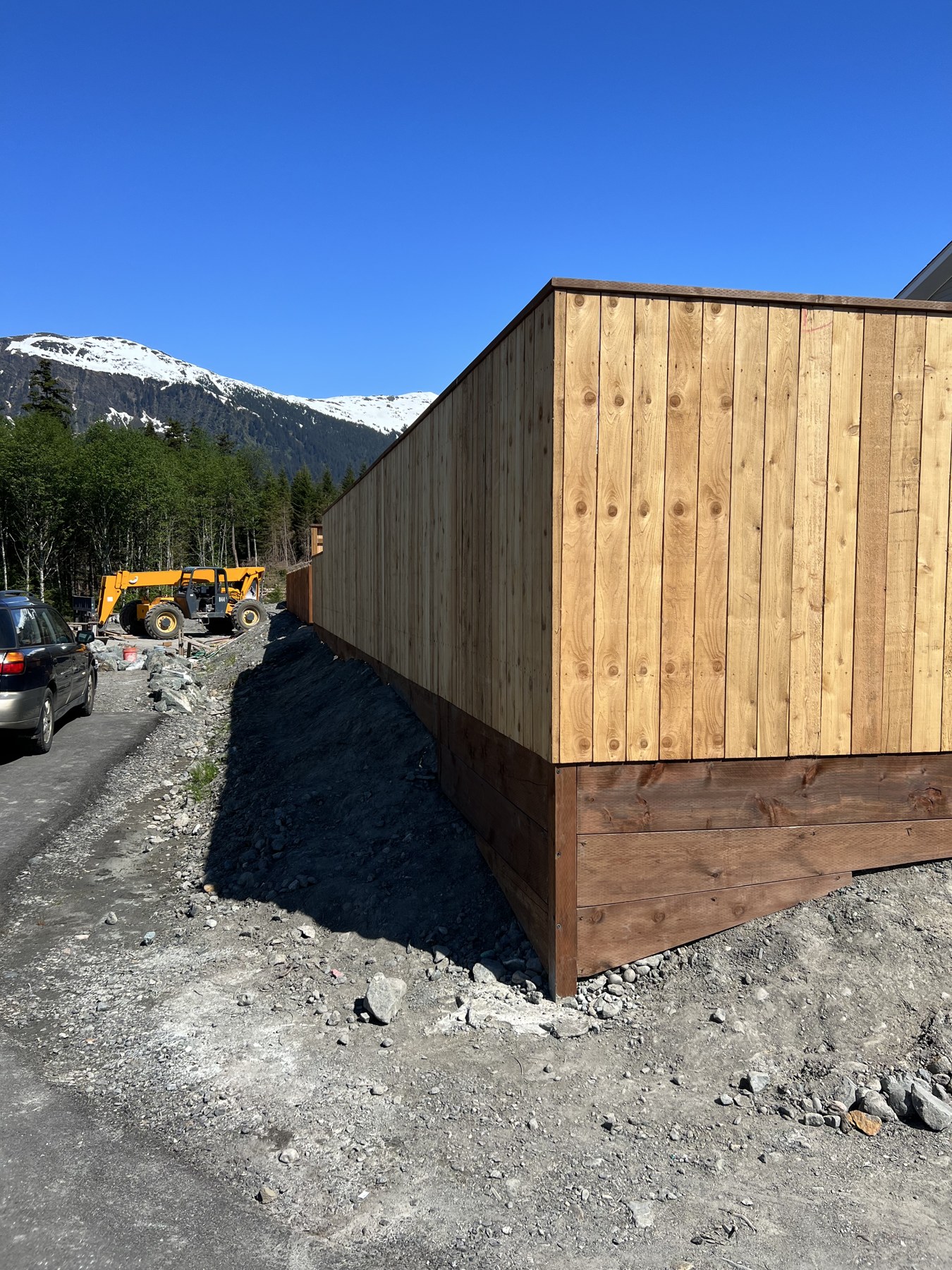 New wood-clad structure with mountain views