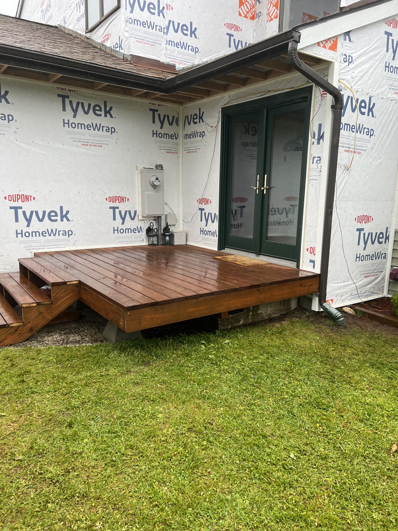 New wood entry deck during exterior renovation