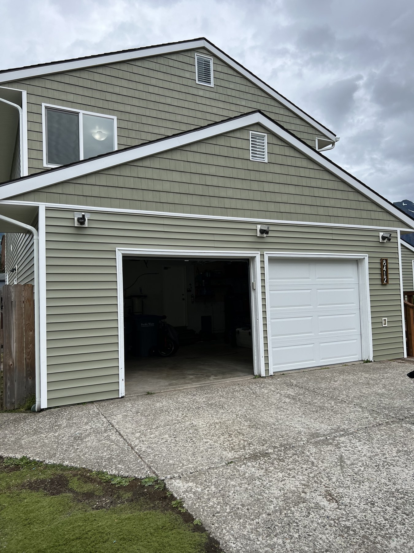 Gray-sided garage and upper-story exterior