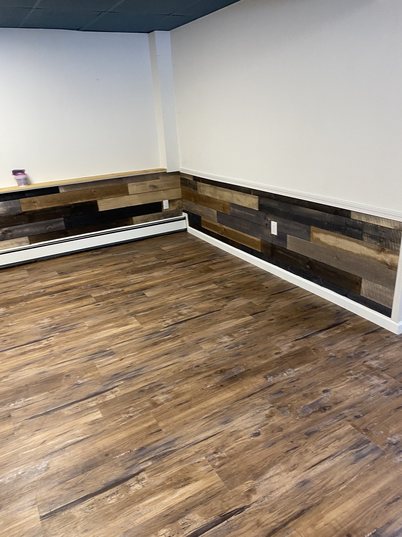 Corner detail of wood wall accents and new flooring
