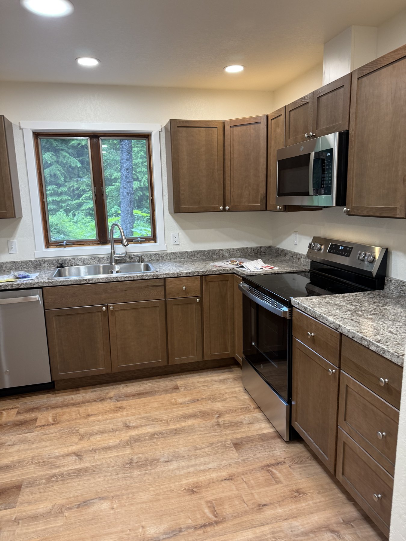 Completed kitchen with wood cabinets and stainless steel appliances